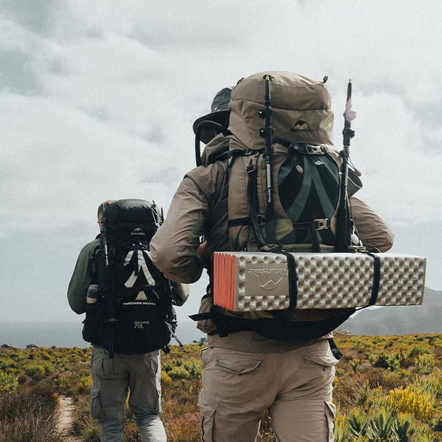 Two guys equipped with all the gear for a bachelor's weekend.Two guys equipped with all the camping gear for a bachelor's weekend.