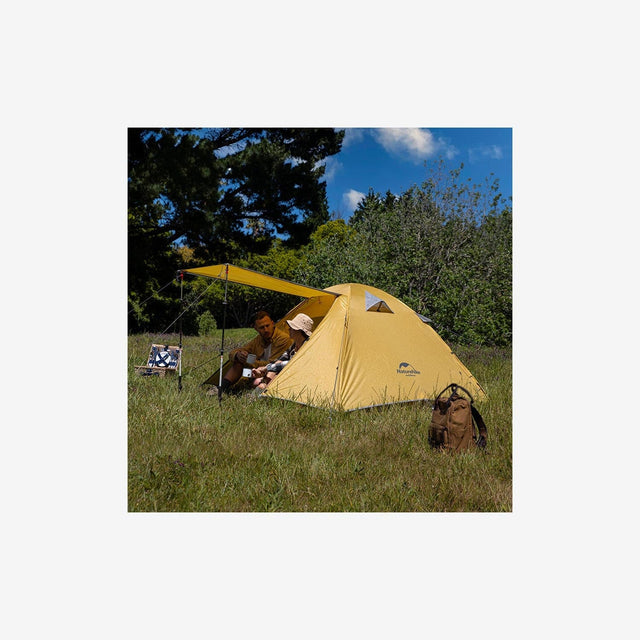 Campers setting up the P Series 2P tent in a forest or mountain campsite