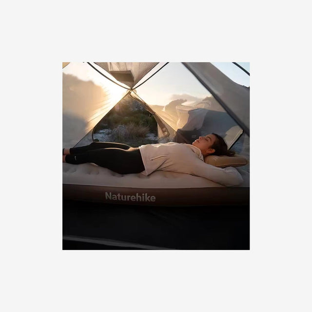 Camper or guest sleeping on C20 mattress inside a tent or guest room
