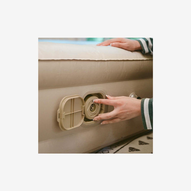 Close-up of built-in pump control and textured mattress surface