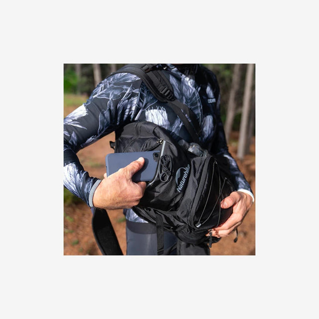 Cyclist wearing Naturehike Cielo backpack on a mountain trail