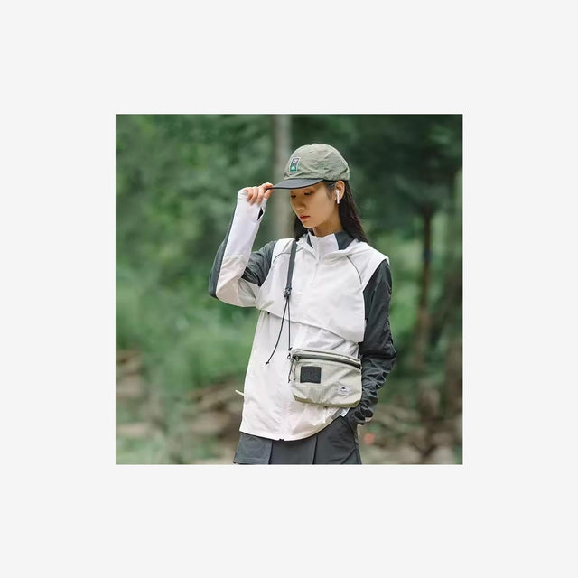 Traveler wearing Naturehike 3L messenger bag during city exploration