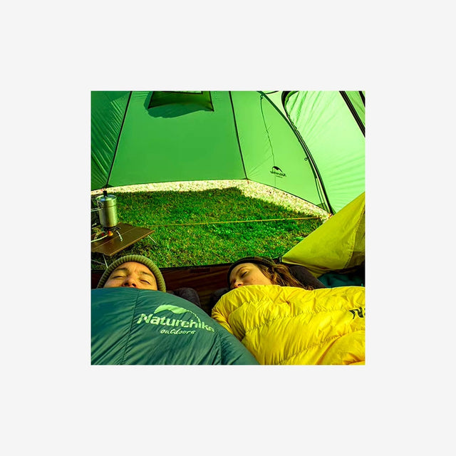 Campers setting up the Opalus 3P tent on a mountain or forest campsite