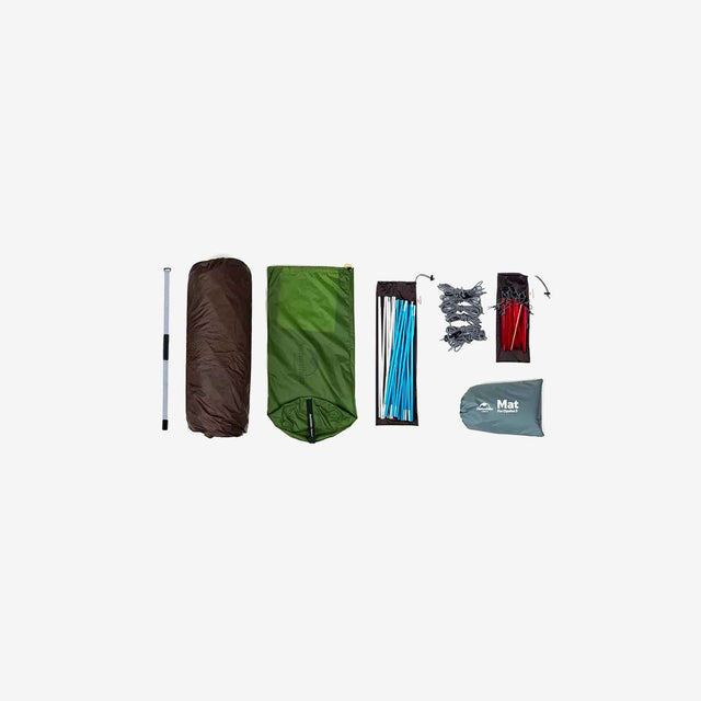 Tent packed compactly in carry bag with poles and stakes