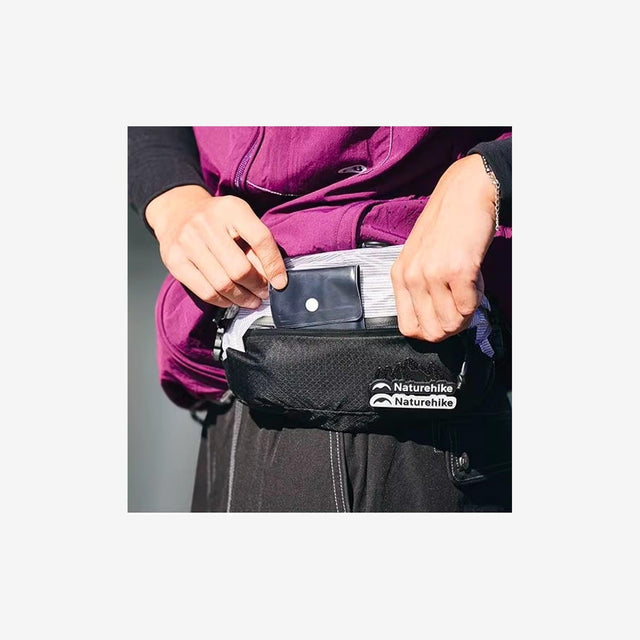 Hiker wearing cross-body chest bag during an outdoor trek