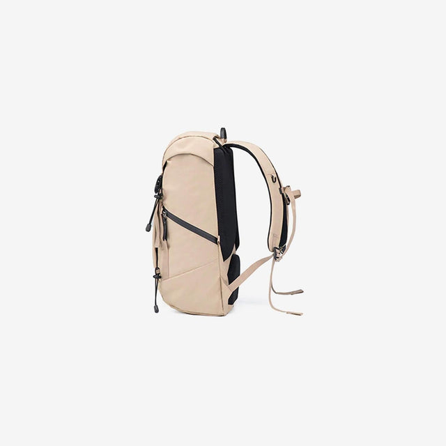 Side view showing padded shoulder straps and mesh side pockets