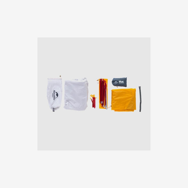 Tent packed compactly in carry bag with poles and stakes