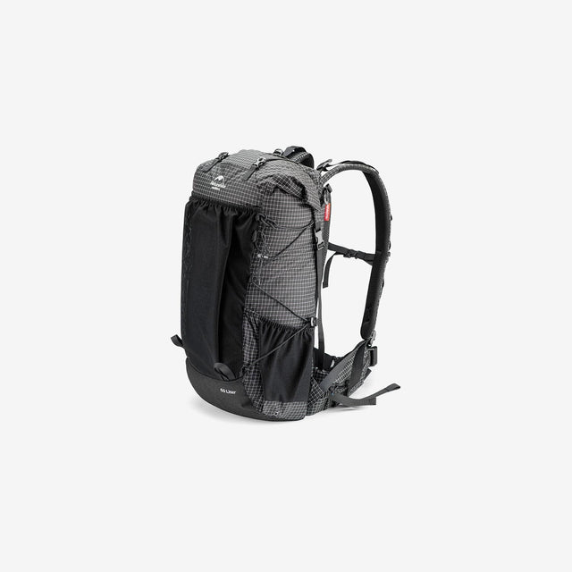 Side profile showing mesh pockets, compression straps, and back ventilation system
