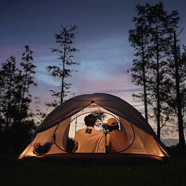 a couple in a tent camping using Naturehike gear and outdoor hacks