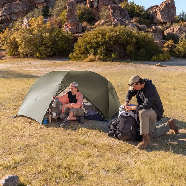 A couple enjoying the best pop-up tent in South africa