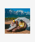 Camper using Naturehike SP1000 sleeping bag outdoors