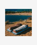Camper using Naturehike SP1000 sleeping bag outdoors